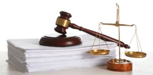 Stack of paper, gavel, justice scale